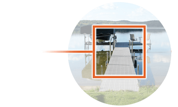 Aluminum dock with chair by a lake, highlighting durability and scenic view. Perfect for waterfront relaxation.