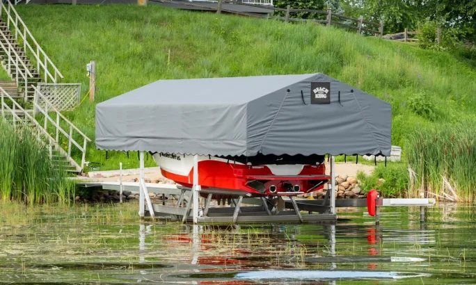 Boat lift with a canopy cover at a residential dock