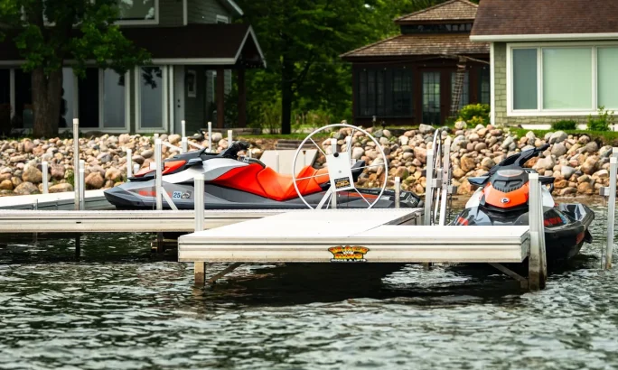 Residential dock system with jet skis on a lake