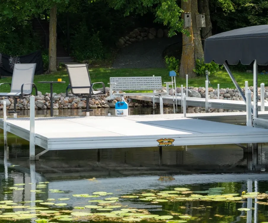 Aluminum dock system with seating area by a tranquil lake